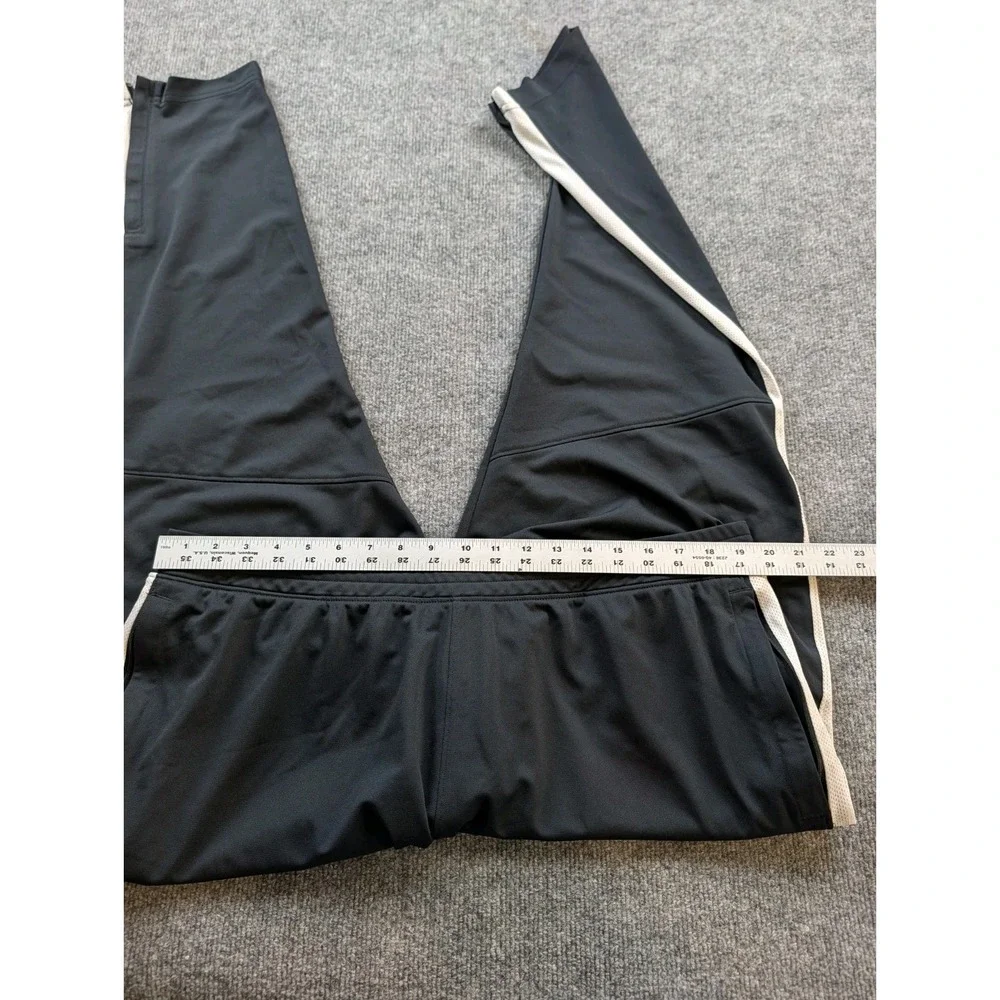 Under Armour Mens Track Pants Size 2XL Black White Stripe Ankle Zippers 1313201